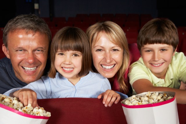 Family Watching Film In Cinema